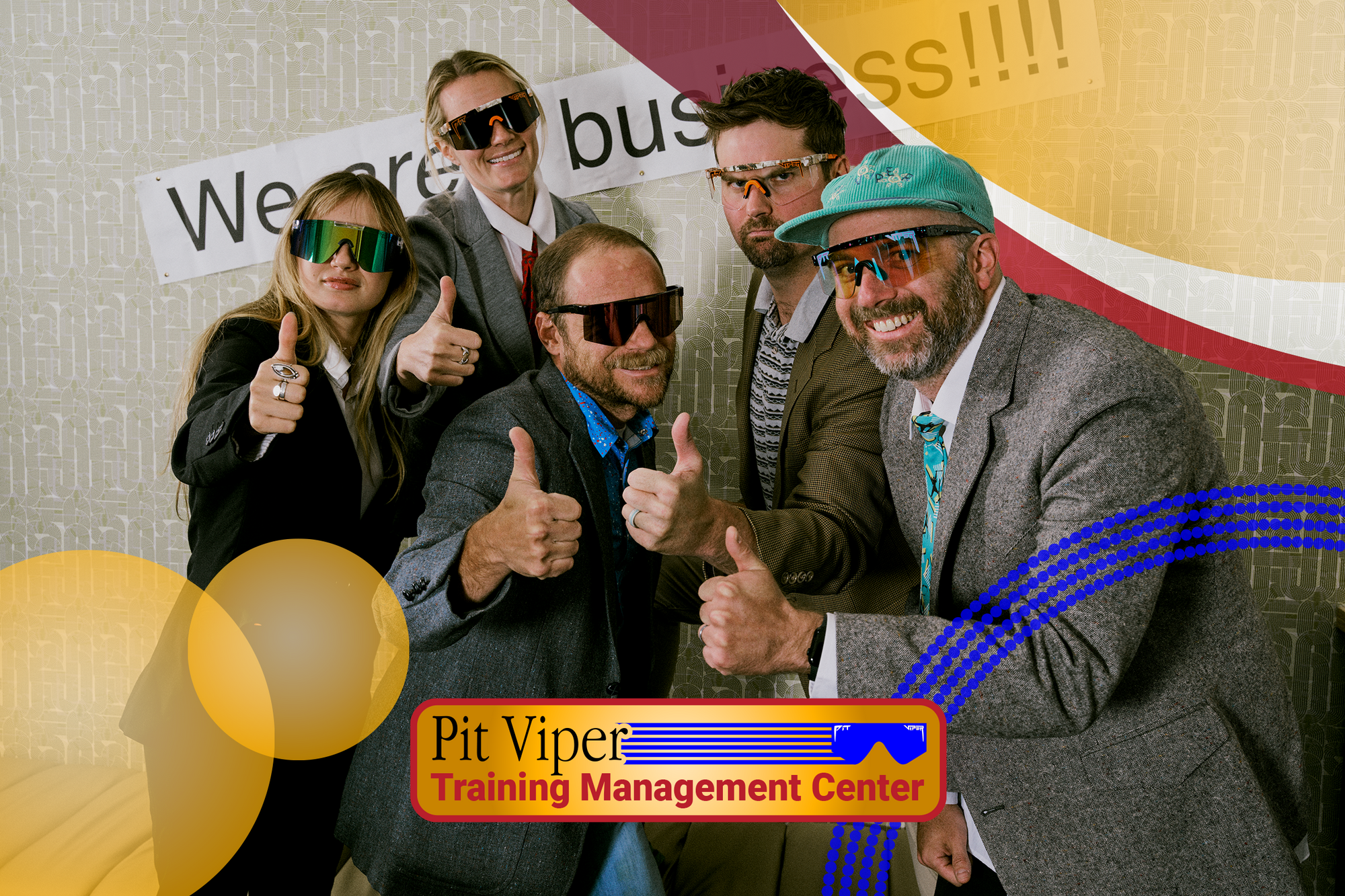 Group of people in formal attire with sunglasses giving thumbs up, Pit Viper Training Management Center logo visible.