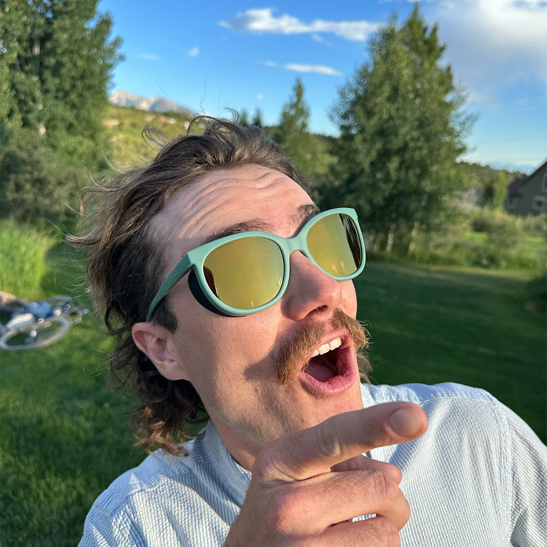 / Gold | peepee.JPG | Man pointing at the sky wearing Pit Viper Sunglasses