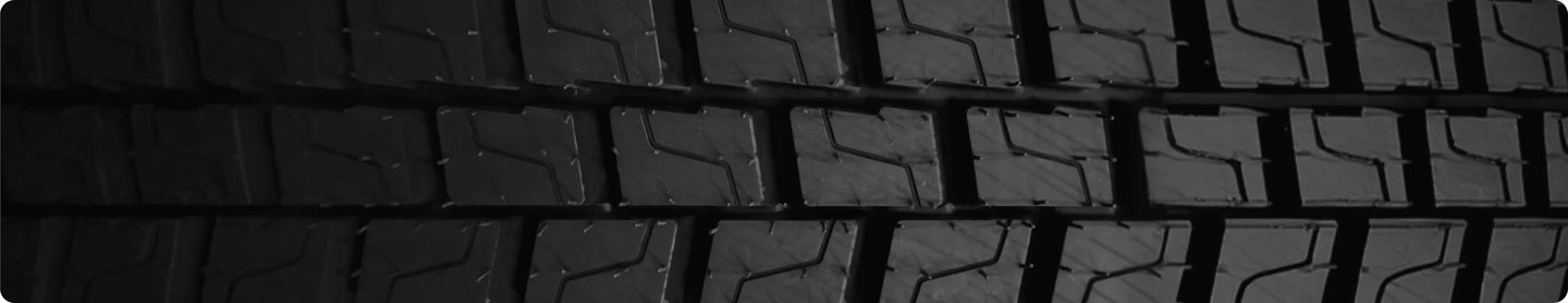Close-up of a black tire tread pattern