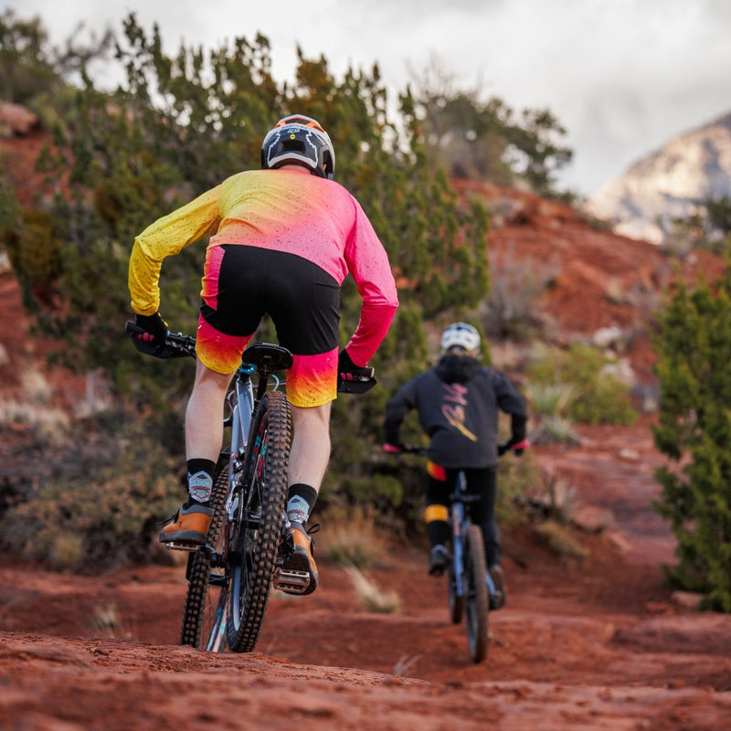  | mountain_bike_lifestyle.JPG | Two mountain bikers riding on red rock terrain wearing the High Speed Off Road Italo MTB Short
