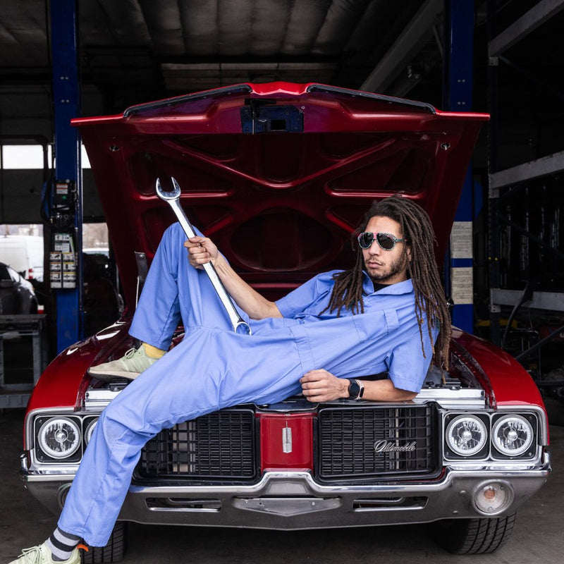 / Polarized Smoke | file.JPG | Man holds large wrench while wearing The Marissa’s Nails Jethawk with a Polarized Smoke lens from Pit Viper Sunglasses
