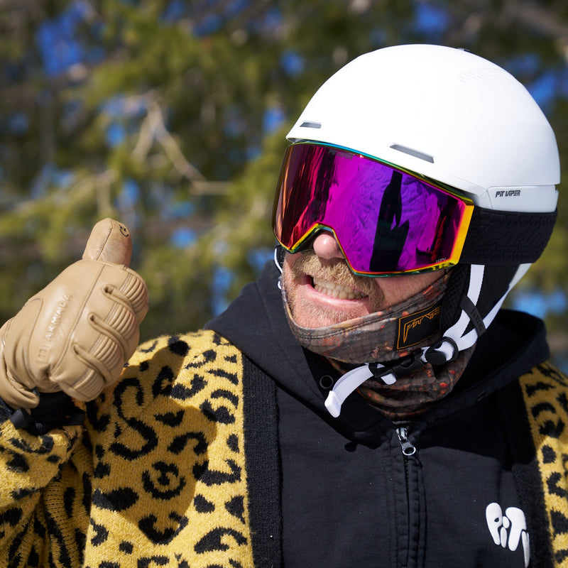 HDPV Red | photo_of_person.JPG | A ma with a mustache wearing a white ski helmet, a leopard sweater and the BN5000 goggles from Pit Viper.