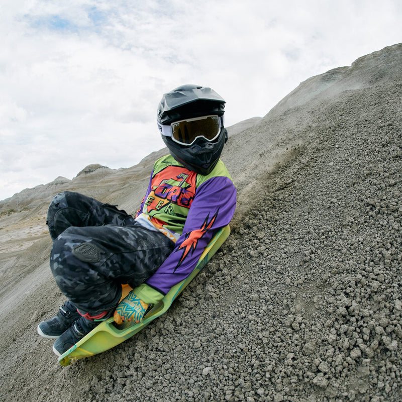 Gold / Large | on_a_person.JPG | Person wearing The Miami Nights Brapstrap Goggle with Gold lens
