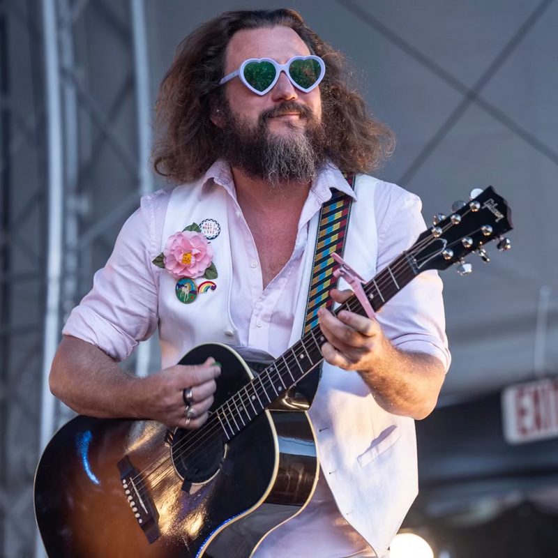  | hi_jim_james.JPG | Person playing guitar on stage with a microphone and equipment visible