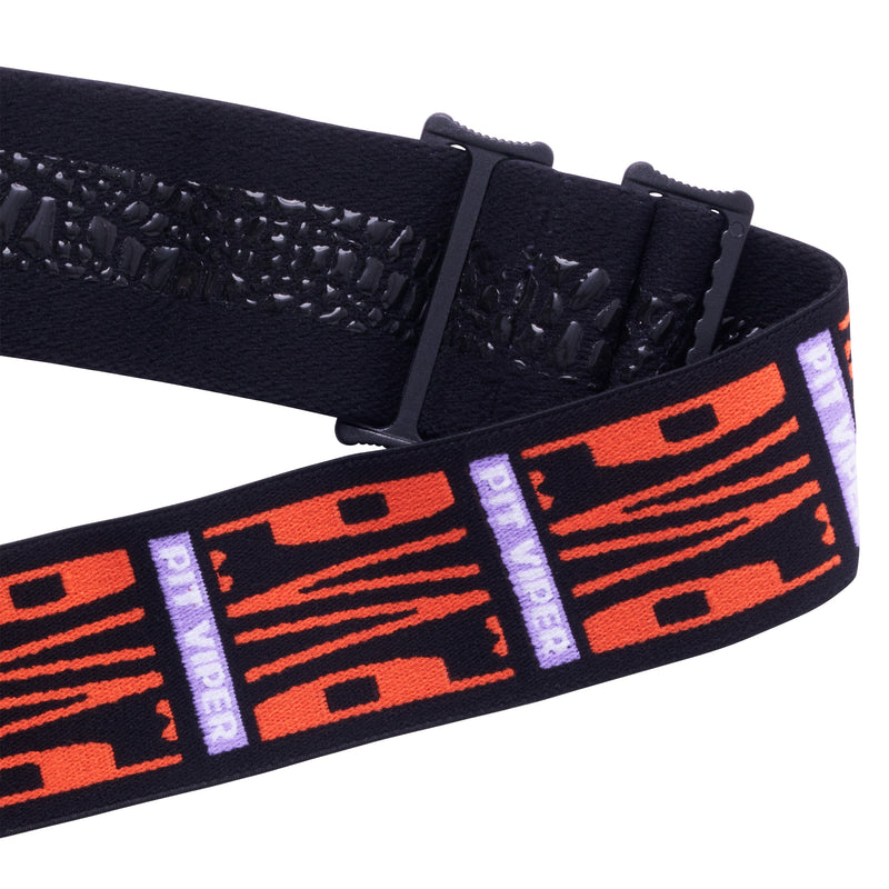 / Smoke | its_a_strap.JPG | A close-up of a black elastic goggle strap with a textured snake skin pattern on the underside and a woven strap featuring orange tiger-stripe graphics and purple vertical 'PIT VIPER' text, shown on a white background.