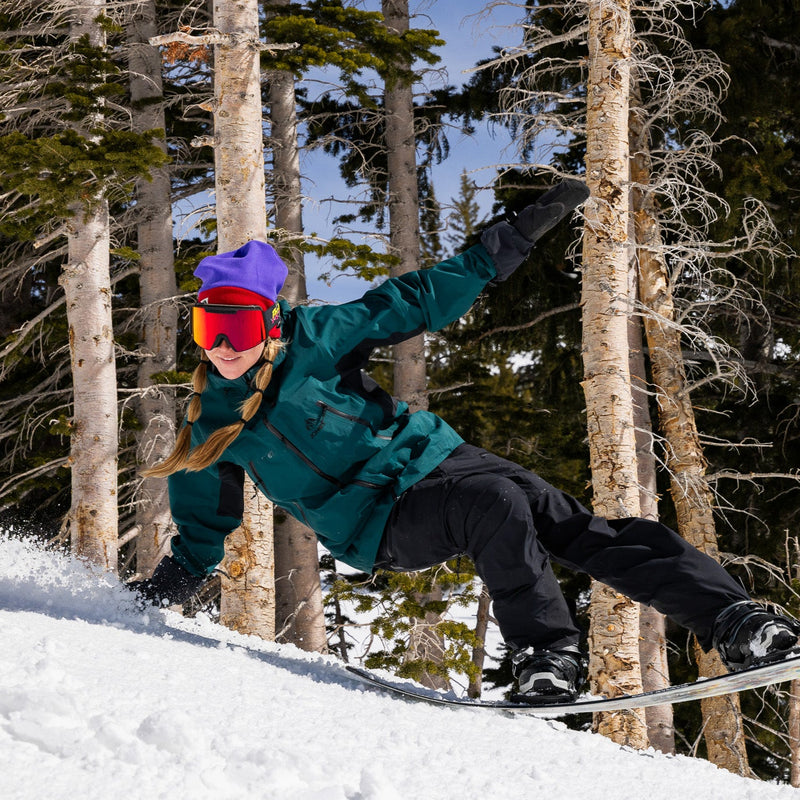 Red / Small | snowboard.JPG | Angled view of The Power Surge Backslap Goggle with red / small lens on white background