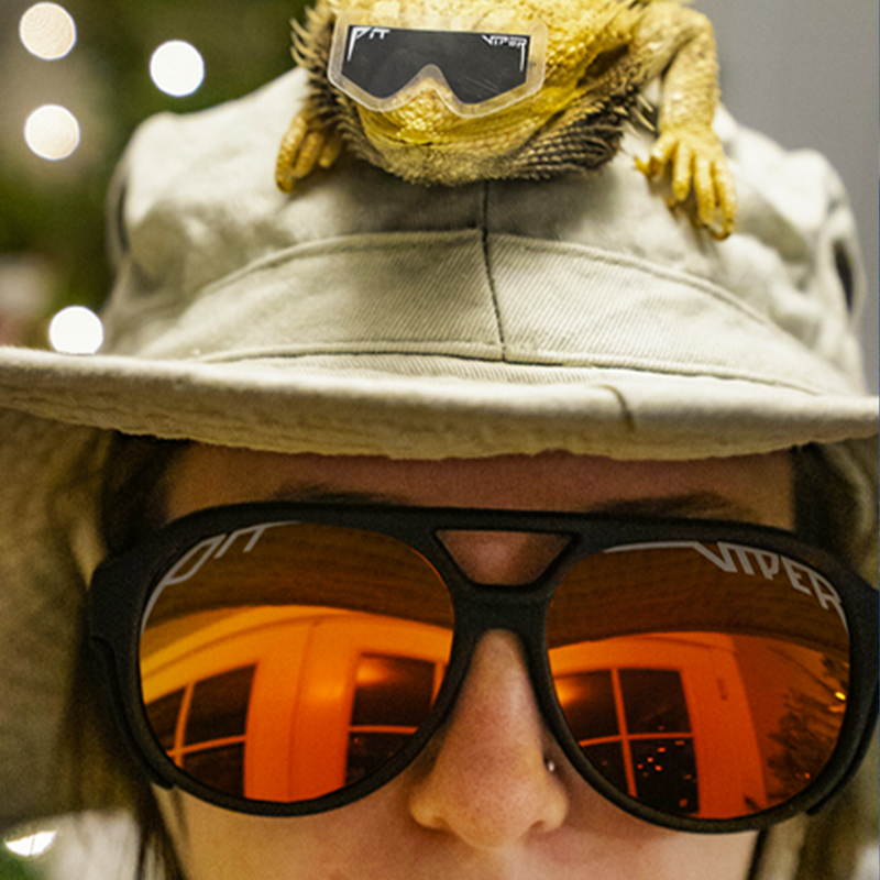  | photo_of_person.JPG | Person wearing The Exec Exciters sunglasses
